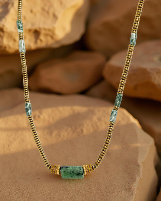 The Daisy Necklace blue and gold floral charm necklace | Handmade daisy charm necklace in blue and gold | Elegant floral charm necklace for women | Blue and gold necklace with daisy details | Artisan handmade floral necklace | Daisy inspired charm necklace close up | Lightweight everyday floral necklace | Boutique handmade necklace photography | Feminine blue and gold charm necklace | Layering necklace with floral design | Unique daisy charm necklace | Gold tone necklace with blue accents 