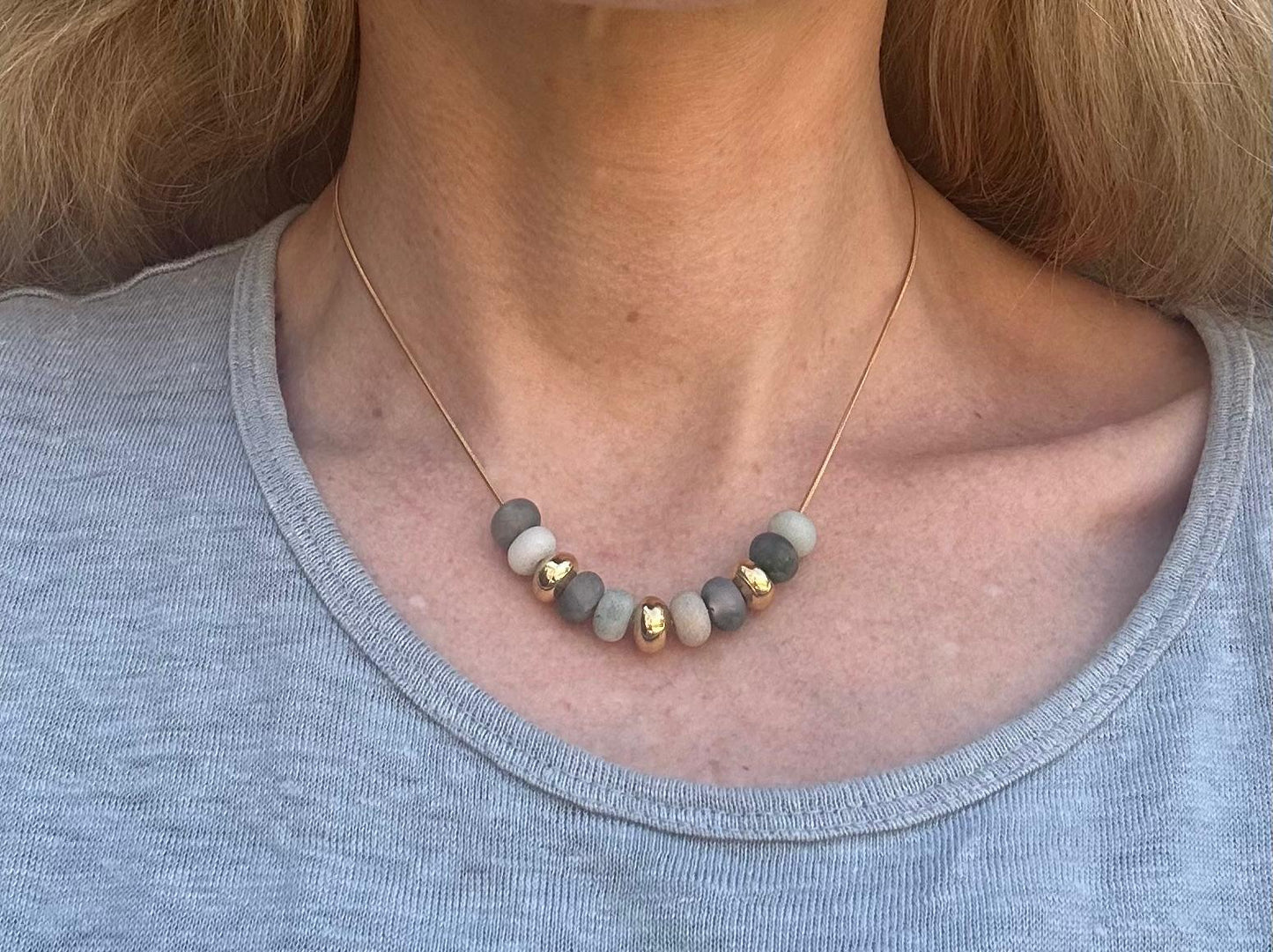 The Delilah handmade natural stone bead necklace | Gold plated snake chain necklace | Waterproof gold necklace for everyday wear | Natural stone bead jewelry close up | Minimalist handmade necklace | Earthy stone bead necklace | Gold accent natural stone necklace | Women’s everyday necklace | Layering necklace with snake chain | Artisan handmade jewelry | Elegant minimalist necklace | Natural gemstone bead necklace | Gold plated waterproof jewelry | Modern handmade necklace design | Timeless everyday neckla